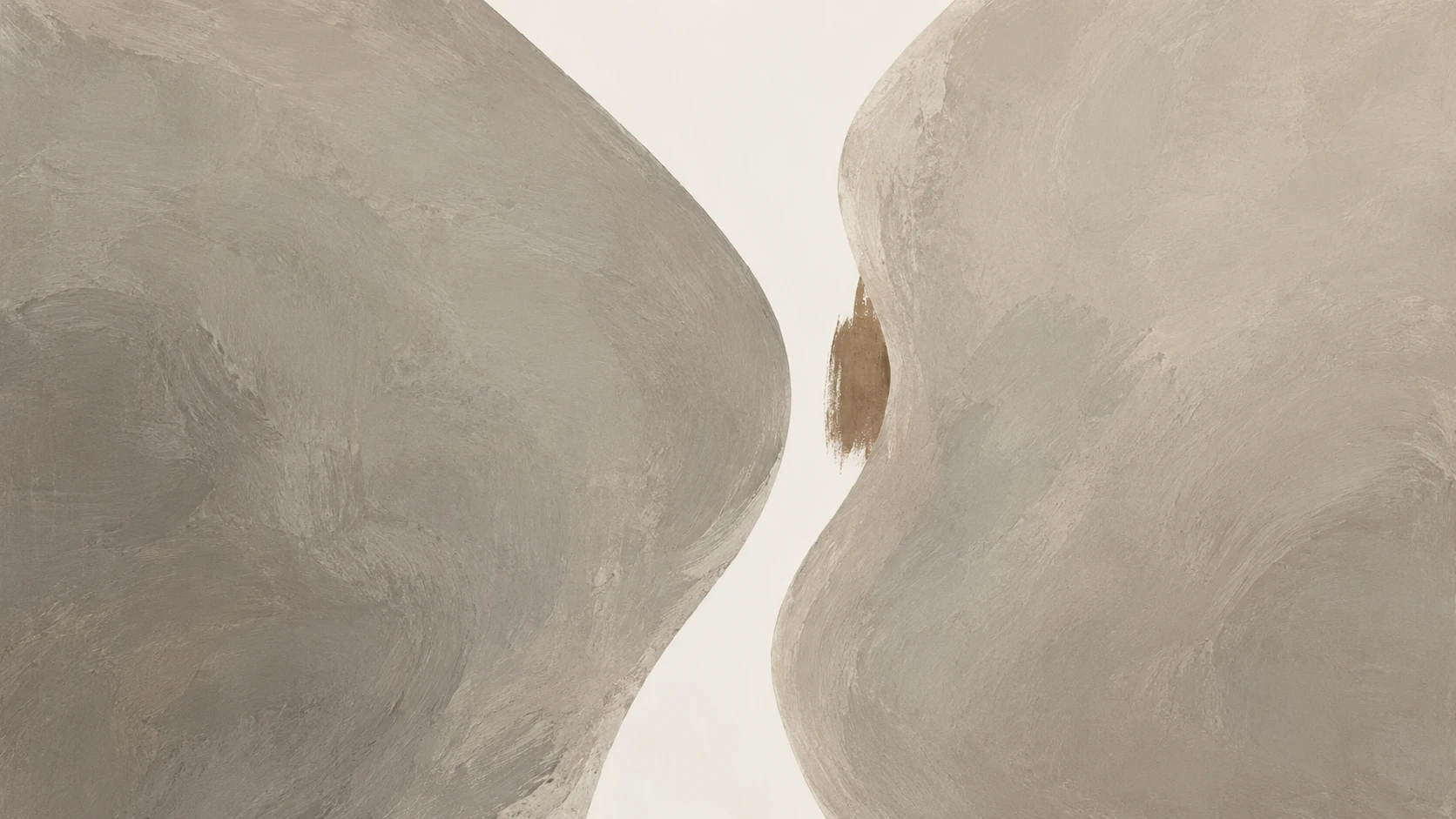 Två rundade grå former med ett ljust, böljande mellanrum.